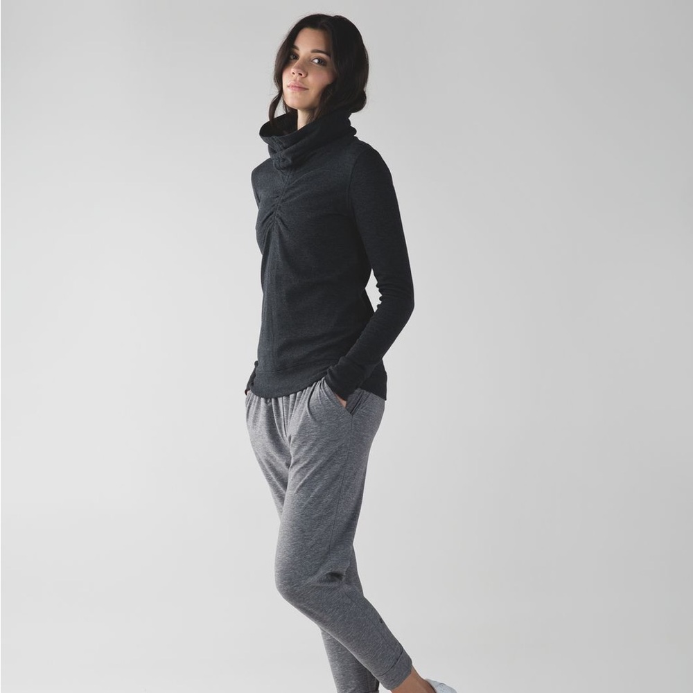 Lululemon In a cinch black pullover w/ ponytail hole.  Size 4, great condition